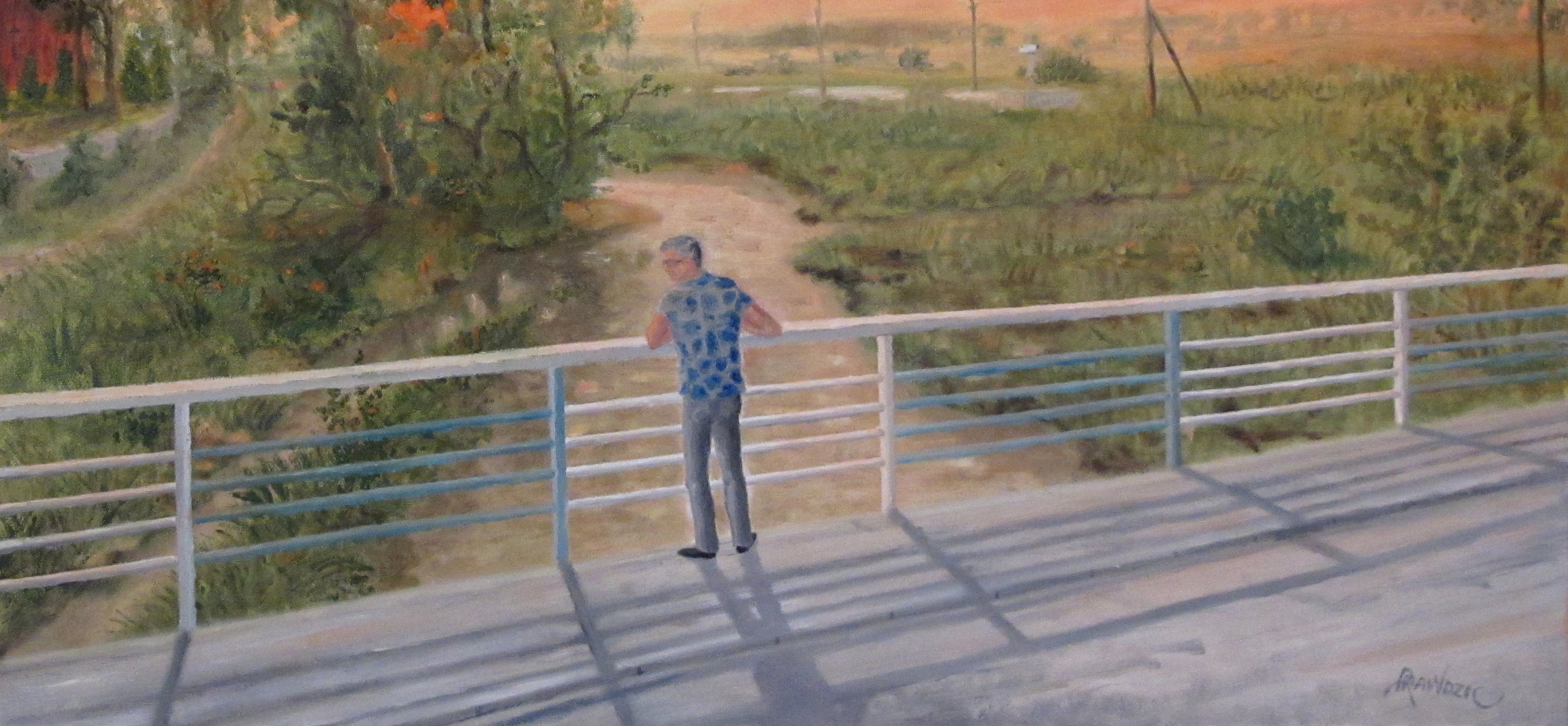 Obraz przedstawiający mężczyznę na moście. Zachód słońca.